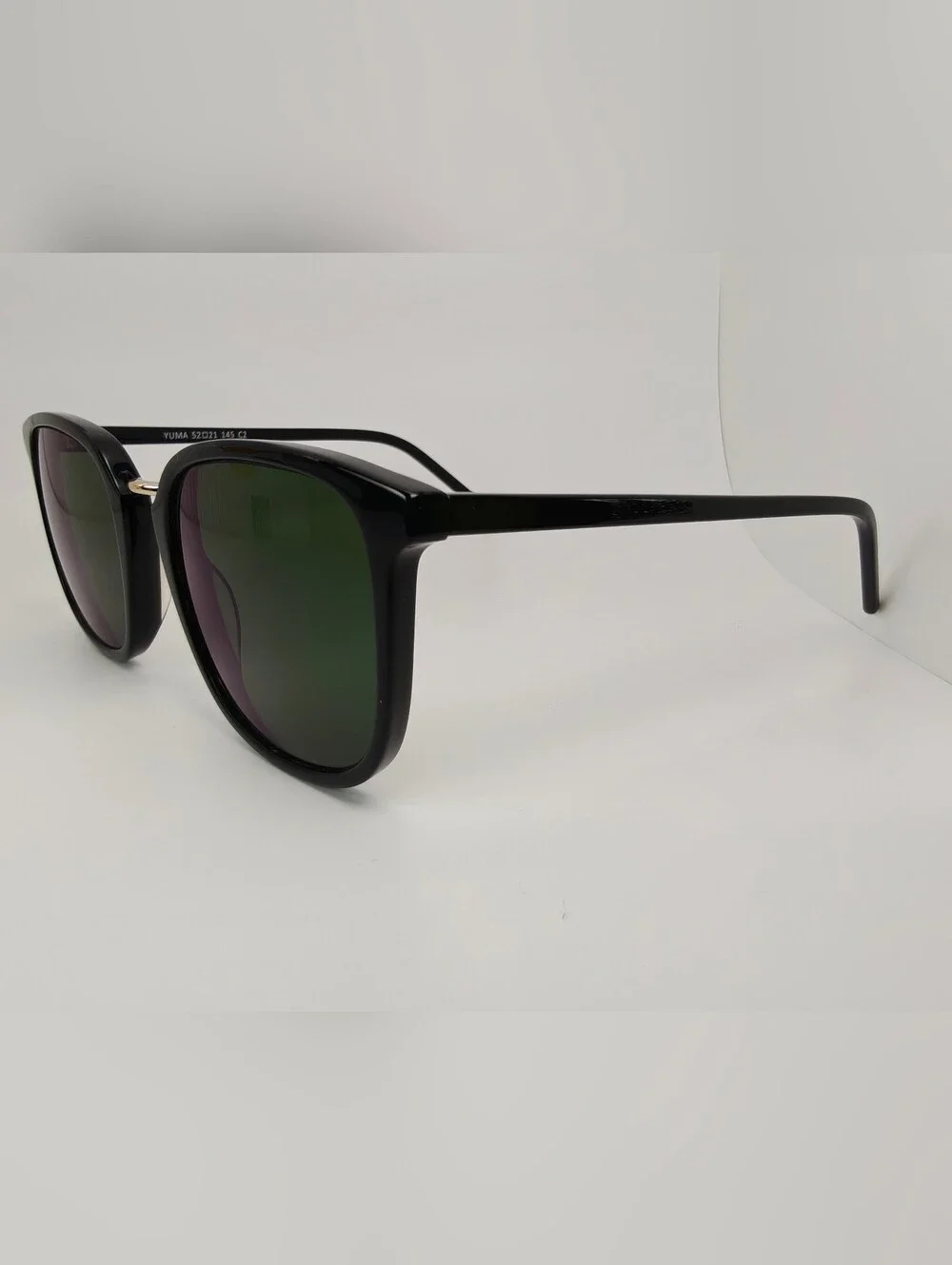Yuma. Classic Black Frame Gold Bridge. Subtle Lines Rounded Square Frame..